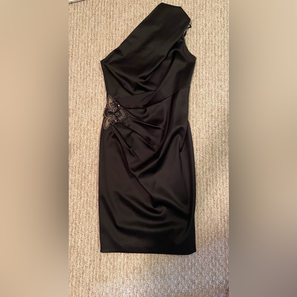 One shoulder sleek black dress with embellishment on right side